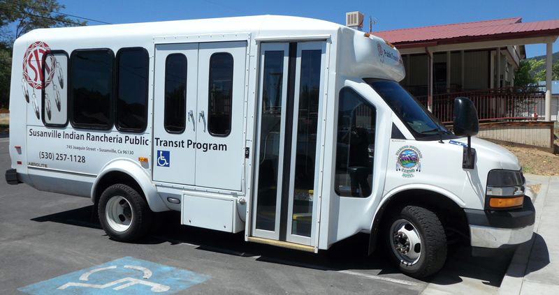 White long van that reads Susanville Indian Rancheria Public Transit Program