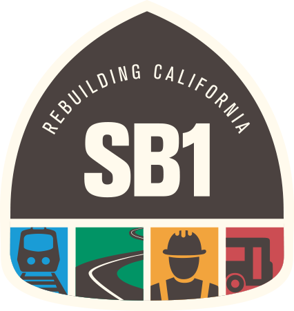 Link to homepage; SB 1 badge logo.